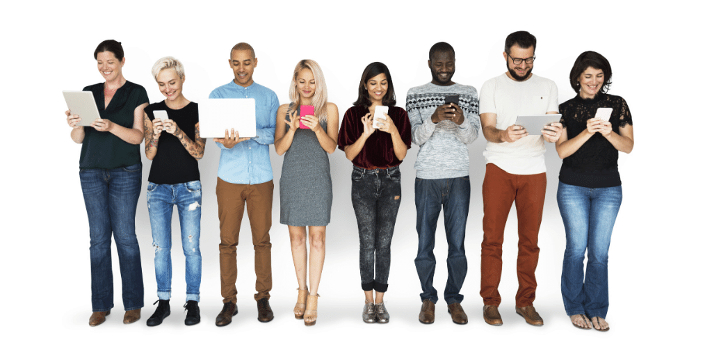 eight people standing side by side looking at smartphones, computers, and tablets