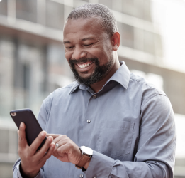 Man looking at his phone and smiling