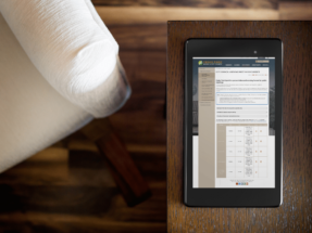 Google Nexus7 on a dark wooden table