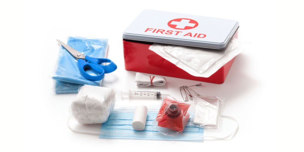 first aid kit with medical supplies outside of it