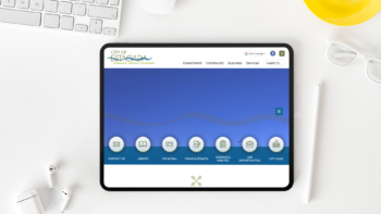 Tablet, keyboard, pencil, and glasses on a white table