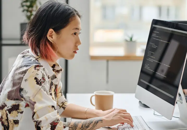 Girl working on a computer at her desk