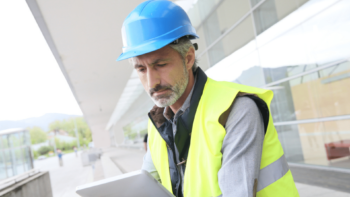 Construction engineer looking at a tablet